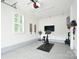 Garage featuring epoxy floors and a Peloton exercise bike at 9596 Pacing Nw Ln, Concord, NC 28027