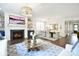 Bright living room with a cozy fireplace, stylish furnishings, and hardwood floors at 9596 Pacing Nw Ln, Concord, NC 28027