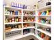 Well-organized pantry with ample shelving, stocked with a variety of food and beverage items at 9596 Pacing Nw Ln, Concord, NC 28027