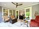 Inviting covered patio with comfortable seating and a fire pit, perfect for relaxing outdoors at 9596 Pacing Nw Ln, Concord, NC 28027