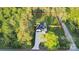 Aerial view of a pristine home with lush green surroundings, and a defined property line at 10125 Bethel Church Rd, Midland, NC 28107