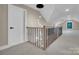 Spacious attic features modern railings and a unique pendant light fixture at 10125 Bethel Church Rd, Midland, NC 28107