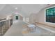 This large attic space features two windows, a small table with chairs, and a seating area at 10125 Bethel Church Rd, Midland, NC 28107