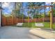 Beautiful backyard with charming swing set and flower baskets for a relaxing outdoor space at 10125 Bethel Church Rd, Midland, NC 28107