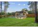 Spacious backyard featuring a unique swing set and seating area perfect for relaxation and entertainment at 10125 Bethel Church Rd, Midland, NC 28107