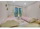 Charming bedroom with twin beds, soft decor, and plenty of natural light from the exterior view at 10125 Bethel Church Rd, Midland, NC 28107