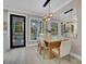 Dining room with modern lighting fixture, large windows, and view of the outdoor space at 10125 Bethel Church Rd, Midland, NC 28107