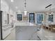Open kitchen and dining space featuring marble island with bar stools, and modern appliances at 10125 Bethel Church Rd, Midland, NC 28107