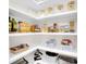 Well-organized pantry shelves filled with a variety of dry goods and storage containers at 10125 Bethel Church Rd, Midland, NC 28107