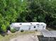 Aerial view of the single-story home, showing the roof, carport, and surrounding greenery at 1029 Sullivan St, Wadesboro, NC 28170