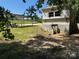 Exterior angle view of the home showing its parking shelter, and a picnic table set at 1029 Sullivan St, Wadesboro, NC 28170