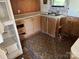 The kitchen highlights the countertops, sink and cabinets that are in need of remodeling and repairs at 1029 Sullivan St, Wadesboro, NC 28170