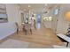Open concept kitchen, dining and living area with light wood floors and white walls at 106 Greentree Dr, Mount Holly, NC 28120