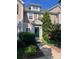 Charming townhome featuring a well-manicured front yard and a welcoming dark green front door at 10649 Trolley Run Dr, Cornelius, NC 28031