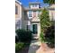 Charming townhome featuring a well-manicured front yard and a welcoming dark green front door at 10649 Trolley Run Dr, Cornelius, NC 28031