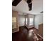 This bright living room features hardwood floors, a ceiling fan, and sun-filled windows at 10649 Trolley Run Dr, Cornelius, NC 28031