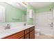 Bathroom with double sink vanity, tiled floors, combination tub and shower at 1071 Bassett Way, Fort Mill, SC 29707