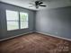 Bright bedroom with neutral walls, carpet flooring, ceiling fan and natural light from double windows at 1071 Bassett Way, Fort Mill, SC 29707