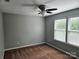 Inviting bedroom with neutral walls, ceiling fan, carpet flooring and double windows for natural light at 1071 Bassett Way, Fort Mill, SC 29707