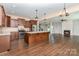 Spacious open-concept kitchen, island and living room with modern stainless appliances at 1071 Bassett Way, Fort Mill, SC 29707