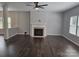 Spacious living room featuring hardwood floors and a fireplace at 1071 Bassett Way, Fort Mill, SC 29707