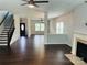 Open concept living space with hardwood flooring, fireplace, and staircase at 1071 Bassett Way, Fort Mill, SC 29707
