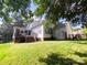 Spacious backyard featuring a deck, a fenced yard, and mature trees, ideal for outdoor gatherings at 10804 Back Ridge Rd, Charlotte, NC 28277