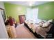 Bedroom with a bed, a ceiling fan, and light-green walls at 10804 Back Ridge Rd, Charlotte, NC 28277