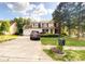 Charming two-story home featuring a well-manicured lawn, inviting entrance, and attached two-car garage at 10804 Back Ridge Rd, Charlotte, NC 28277