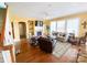 Cozy living room with hardwood floors, a fireplace, and a large window, and comfortable seating at 10804 Back Ridge Rd, Charlotte, NC 28277