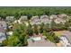 Aerial view of homes in a neighborhood featuring a swimming pool at 10822 Brandie Meadow Ln, Huntersville, NC 28078