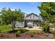 This backyard features a patio, dining area, fire pit, and screened in porch at 10822 Brandie Meadow Ln, Huntersville, NC 28078