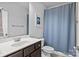 Functional bathroom with single sink vanity and a shower-tub combo at 10822 Brandie Meadow Ln, Huntersville, NC 28078