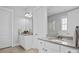 Bright bathroom with dual vanities, modern fixtures, and a glass-enclosed shower at 10822 Brandie Meadow Ln, Huntersville, NC 28078