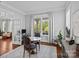 Bright dining area with hardwood floors, a round table with chairs, and an open doorway to the living room at 10822 Brandie Meadow Ln, Huntersville, NC 28078