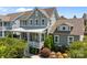 Beautiful two-story home featuring a covered front porch, well-manicured landscaping, and classic design at 10822 Brandie Meadow Ln, Huntersville, NC 28078