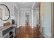 Bright and spacious foyer featuring hardwood floors, elegant wainscoting, and an open doorway at 10822 Brandie Meadow Ln, Huntersville, NC 28078