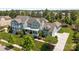 Two-story home with a charming porch, white railings, and lush landscaping at 10822 Brandie Meadow Ln, Huntersville, NC 28078