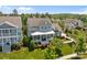 Two-story home with a charming porch, white railings, and lush landscaping at 10822 Brandie Meadow Ln, Huntersville, NC 28078