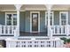 Close-up of the charming front porch, showcasing the house number, stylish lighting, and elegant entrance at 10822 Brandie Meadow Ln, Huntersville, NC 28078