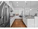 Spacious kitchen with stainless steel appliances, hardwood floors and white cabinetry at 10822 Brandie Meadow Ln, Huntersville, NC 28078