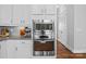 Modern kitchen featuring stainless steel appliances and white cabinets at 10822 Brandie Meadow Ln, Huntersville, NC 28078