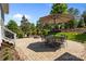 Spacious patio with an outdoor dining set, firepit, and landscaped surroundings for relaxing at 10822 Brandie Meadow Ln, Huntersville, NC 28078