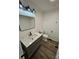 Updated bathroom featuring a modern vanity with quartz countertops and matte black fixtures, offering a clean and stylish aesthetic at 1109 Reid Harkey Rd, Matthews, NC 28105