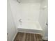 Bright bathroom featuring a clean white tub and shower combination, offering a functional and relaxing space at 1109 Reid Harkey Rd, Matthews, NC 28105