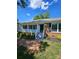 Charming brick home featuring a welcoming front porch and beautifully landscaped front yard on a sunny day at 1109 Reid Harkey Rd, Matthews, NC 28105