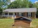 Front exterior view of the house with brick mailbox at 1109 Reid Harkey Rd, Matthews, NC 28105