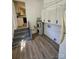 Functional utility room with laundry hookups and cabinet storage space, next to a kitchen area at 1109 Reid Harkey Rd, Matthews, NC 28105