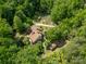 Aerial view of a home with mature trees and greenery surrounding the perimeter of the property at 1160 Walton Pl, Salisbury, NC 28146