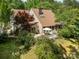 Aerial view of the property showcasing a deck, lush trees, and home exterior at 1160 Walton Pl, Salisbury, NC 28146